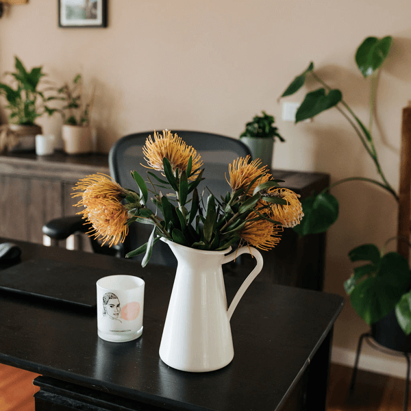 Desk and vase with orange flowers